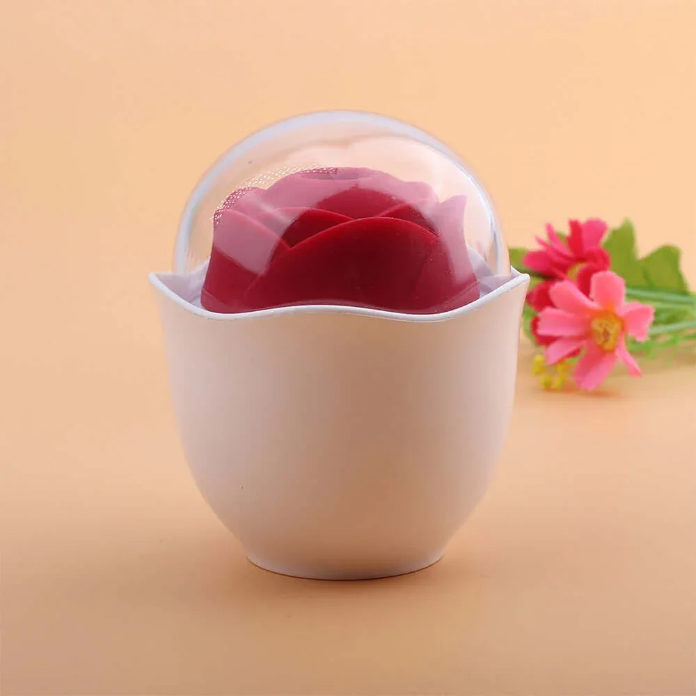 Roselle Nest Compact Rose Suction Toy — closed cup in a styled setting